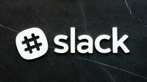 pexels photo 430205 430205 Close-up of Slack logo with hashtag symbol on a dark textured background, emphasizing digital communication.